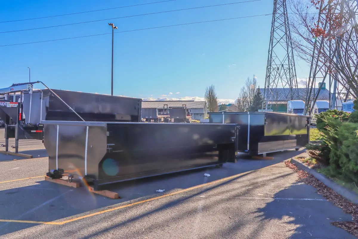 Roll-off dumpster ready for waste disposal at job site for 2 Yard Dumpster Rental in Bonadelle Ranchos